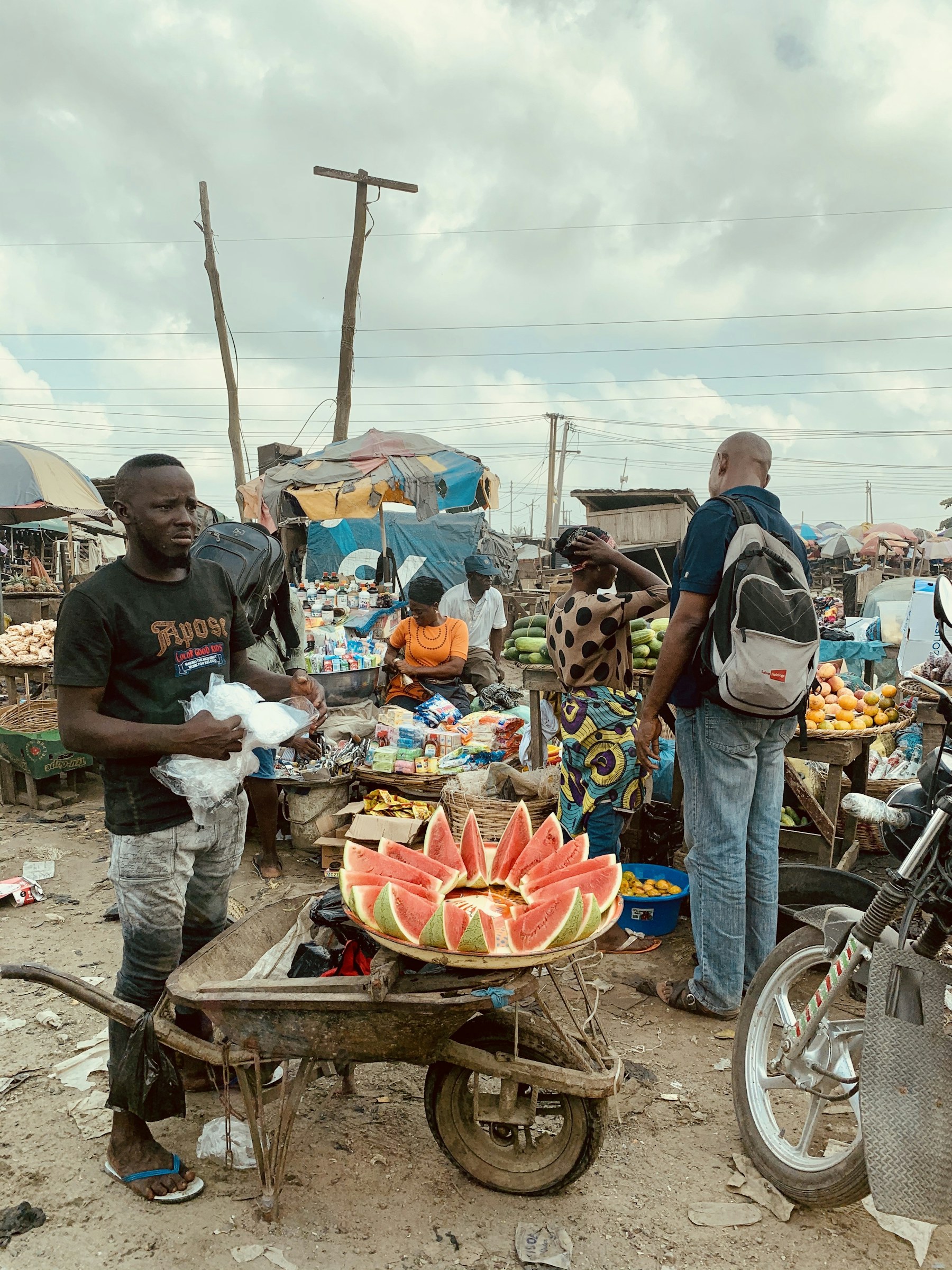Fruit seller and pedestrians in Lagos