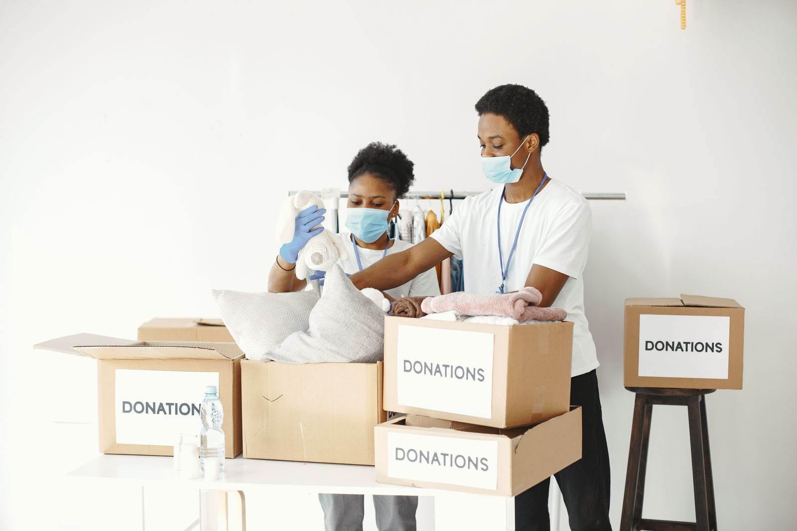 Volunteers packing goods in boxes