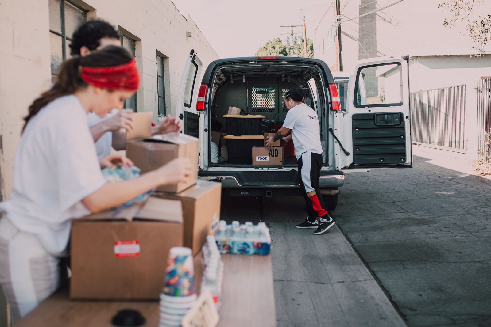 Boxes of supplies being moved from a van